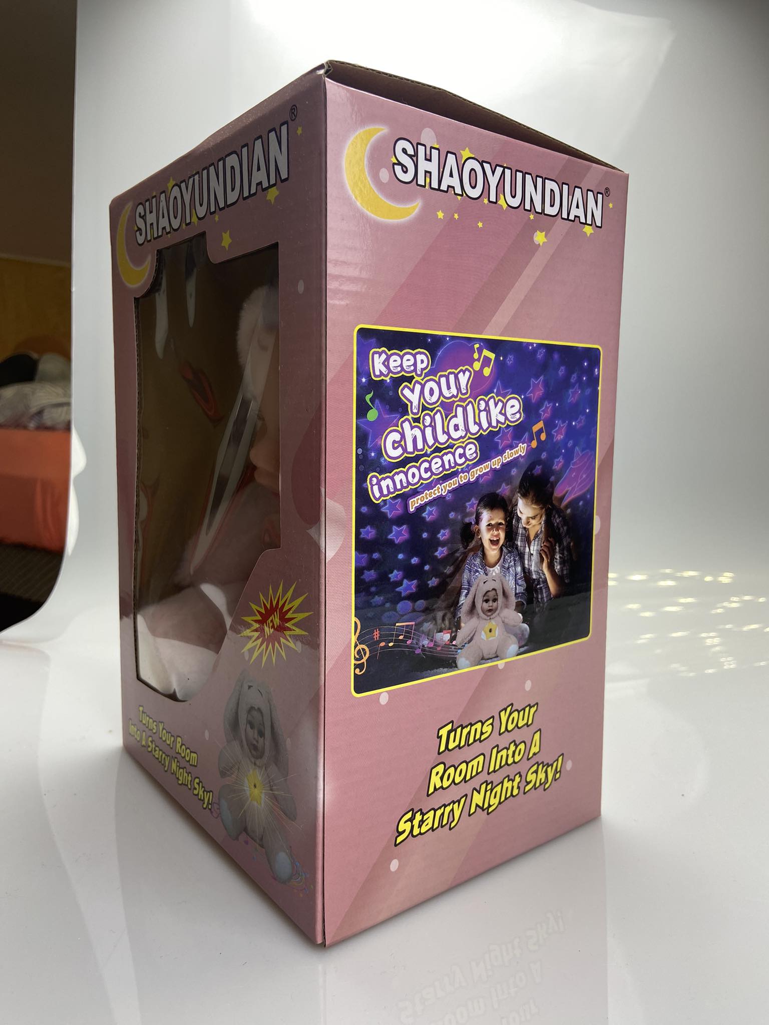 Grojanti lopšines lėlytė su šviesų projektoriumi (1)